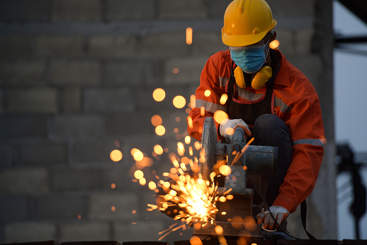 Manufacturing foundry worker busy welding